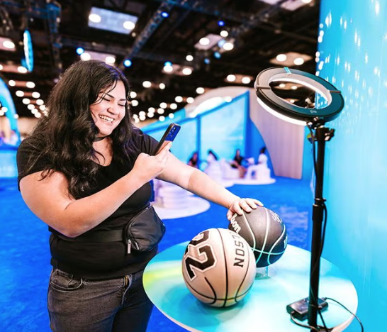 Visitor interacting with a basketball-themed fan activation